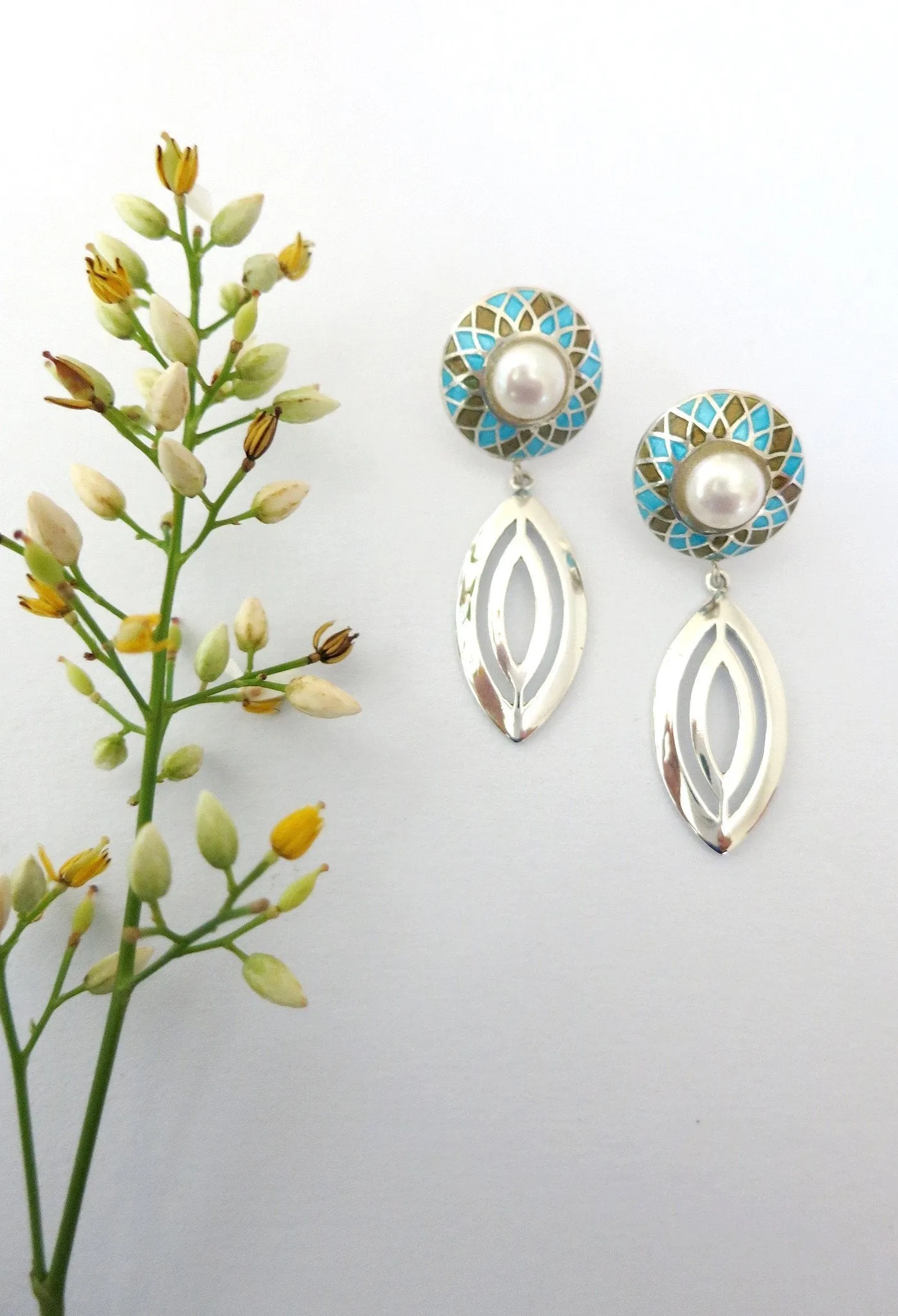 Classic, navette-shape earrings in blue and sepia enamel with pearl center
